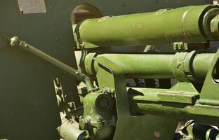 A close-up mechanism of a portable weapon of the Soviet Union of World War II, painted in a dark green color photo