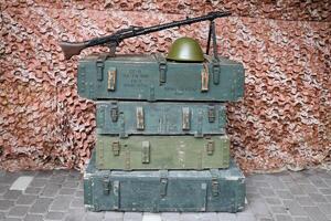 Soviet army ammunition stack of green crates with russian names of ammo type and category photo