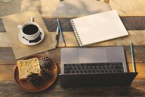 Coffee cup hot on wooden old table in the morning photo