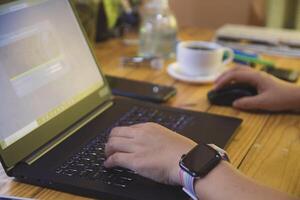 Women using working and drink coffee cup hot at home photo