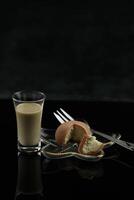 Color japanese sweets daifuku mochi with glass of irish cream liqueur photo