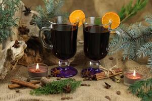 Glasses with mulled wine and spices photo