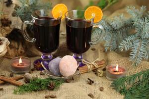Glasses with mulled wine and spices photo