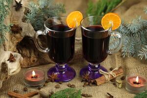 Glasses with mulled wine and spices photo