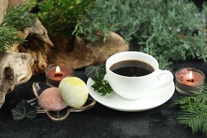 Cup of hot coffee with japanese sweets daifuku mochi photo