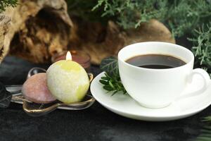 Cup of hot coffee with japanese sweets daifuku mochi photo