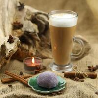 Glass coffee with mochi and spices. Cloth background with copy space photo