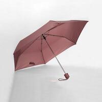 Opened umbrella isolated on white background with clipping path. Umbrella with handle for mock up. copy space, design template for mock-up, branding, advertise etc. Studio Photography shoot photo