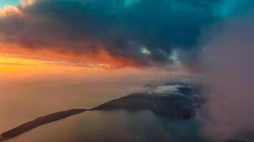 Dramatic sunset clouds over sea photo