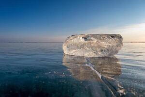 Sunlight refracted in piece of ice photo