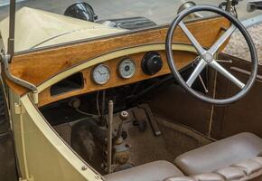 Steering wheel and dashboard of old car photo