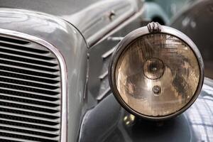 Headlight of old vintage car photo