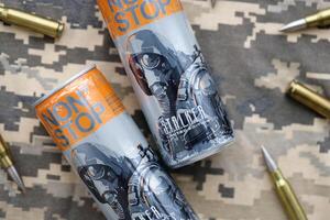 KYIV, UKRAINE - OCTOBER 31, 2023 Non Stop energy drink with limited edition design of Stalker and character with gas mask on aluminium tin can photo