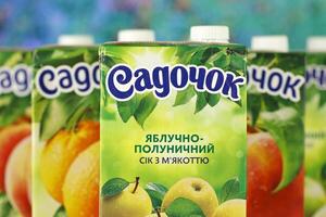 KHARKIV, UKRAINE - JANUARY 2, 2021 Sadochok various taste nectar from peach, apple and strawberry with orange flavour juice photo