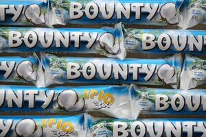 KYIV, UKRAINE - OCTOBER 31, 2023 Bounty chocolate bars with cocoa flavor filling. Bounty chocolate bar is a brand of American Mars Inc photo