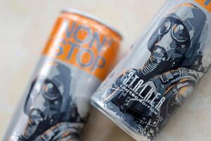 KYIV, UKRAINE - OCTOBER 31, 2023 Non Stop energy drink with limited edition design of Stalker and character with gas mask on aluminium tin can photo