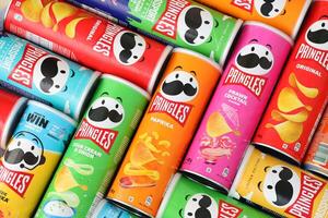 KYIV, UKRAINE - 4 MAY, 2023 Many pringles tubes of chips with various flavours photo