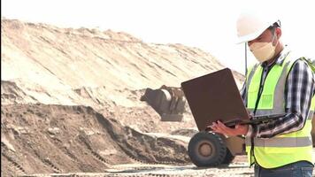 Civil Engineer examine and control of Sand loader working at sandpit. Sand industry. Construction site. video