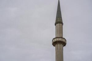 Taksim Square Mosque in front of Republic Monument Istanbul Turkey photo