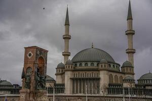 Taksim Square Mosque in front of Republic Monument Istanbul Turkey photo
