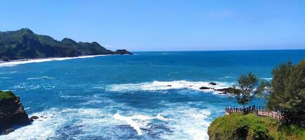 the ocean and cliffs are on the coast, middle Java Indonesia photo