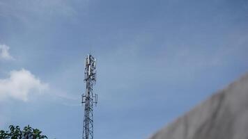 Telecommunication towers rise into the sky photo