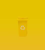 Yellow Recycling Bin On Yellow Background. photo