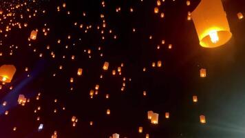 Flying lanterns in night sky in Loy Krathong festival, Chiangmai, Thailand video