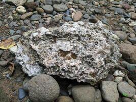 Close up view of the strange patterned background of mountain rocks taken while traveling in Sulawesi, Indonesia photo