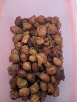 A view of the traditional cake of Ramadan or after the Eid al-Fitr holiday in Indonesia made from nuts as the main ingredient is seen in a bowl on a white background photo