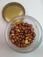 A view of the traditional cake of Ramadan or after the Eid al-Fitr holiday in Indonesia made from nuts as the main ingredient is seen in a bowl on a white background photo