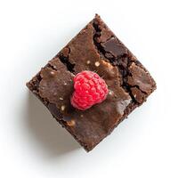 AI generated A slice of raw cacao nib brownie with a raspberry top view isolated on a transparent background photo