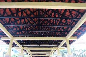 Structure of steel roof frame for building construction. photo