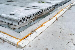 Foundation for building a house, stages of laying the first layer of Foundation for a building, gray, outdoors photo