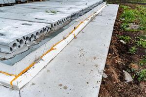 Foundation for building a house, stages of laying the first layer of Foundation for a building, gray, outdoors photo