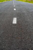 marking on the road going into the distance, asphalt road photo