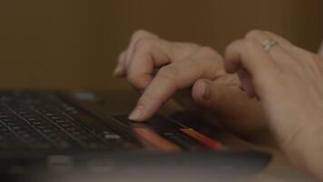 Close up of woman hand touching a tochpad on laptop. Close up of young businesswoman typing on computer laptop at the office or cafe video