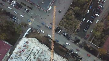 Busy Construction Site and Construction Equipment Aerial view. Clip. Crane in the construction site. Construction site of a high residential building, aerial view. video