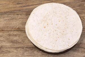 tortilla  on wooden table photo