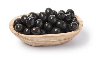 black olives at wooden bowl photo