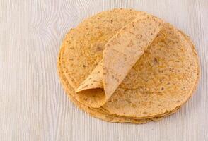 tortilla  on wooden table photo