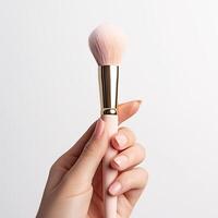 AI generated Manicured Hand Showcases Fluffy Makeup Brush photo