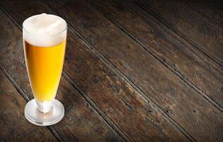 beer glass on wooden photo