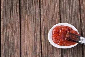 Barbecue sauce with basting brush photo