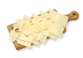 cheese slices on wooden board photo