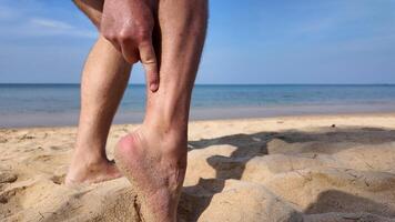 Beachside Ankle Massage with Ocean Backdrop, beach fly bites, beach flea bites photo