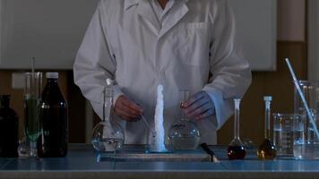 Scientist in a laboratory conducting an experiment on the instantaneous transformation of the liquid into ice. The chemical effect of the liquid or water will instantly freeze video