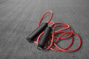 Skipping rope on a gray photo