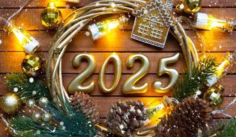 New Year House key with keychain cottage on festive brown wooden background with number 2025 in wreath, lights of garlands. Purchase, construction, relocation, mortgage, insurance photo