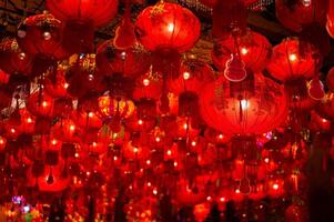 Red lanterns word mean blessing, good health and wealth, get rich hanging at Chinese temple decorating for Chinese new year festival. photo